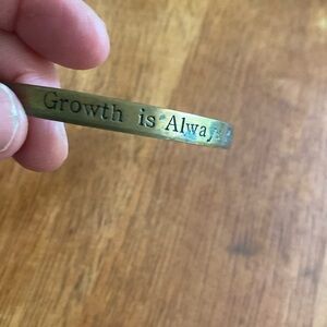 Brass “Growth is always possible” bracelet